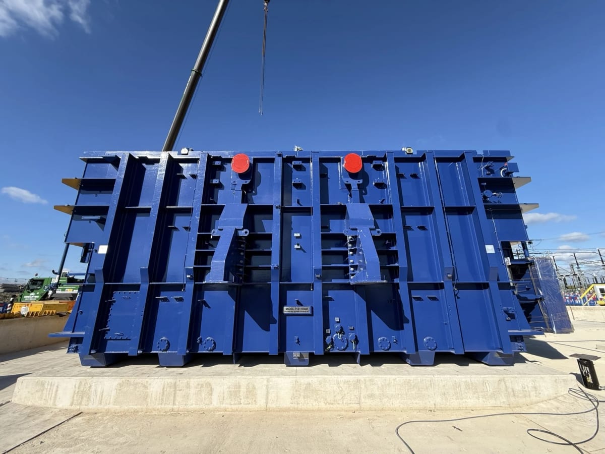 A super grid transformer set down in its final position on a concrete plinth.